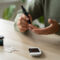 man measuring blood sugar level